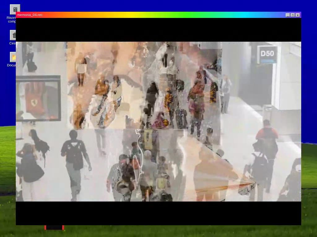 On the blue screen, a window shows a video of a crowd walking through a station, under a rainbow title bar.